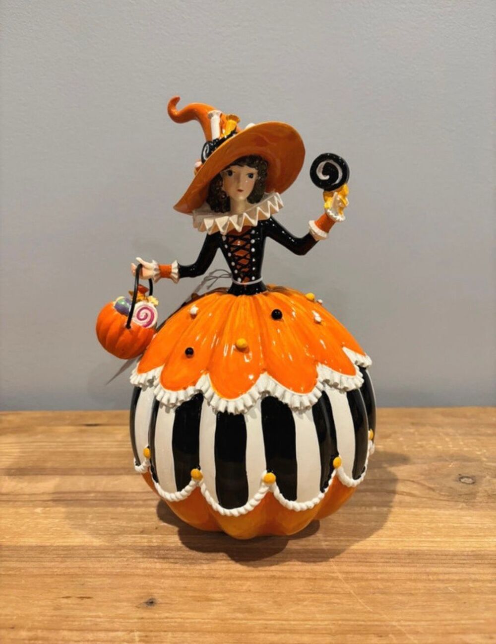 Ghoulish 10" whimsical orange pumpkin candy witch figurine